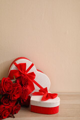 Gifts for Valentine's Day and flowers on table