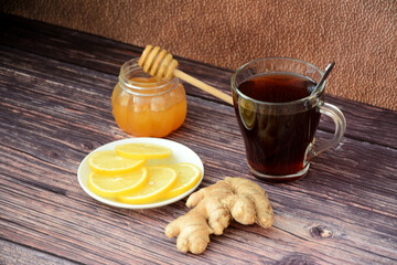 Home remedy for colds: hot black tea, lemon, honey and ginger.