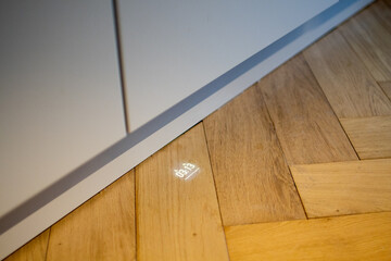 Integrated smart dishwasher display projects information onto the floor