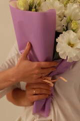 bouquet of white flowers in hands 