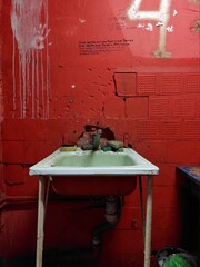 Old sink in student dormitory