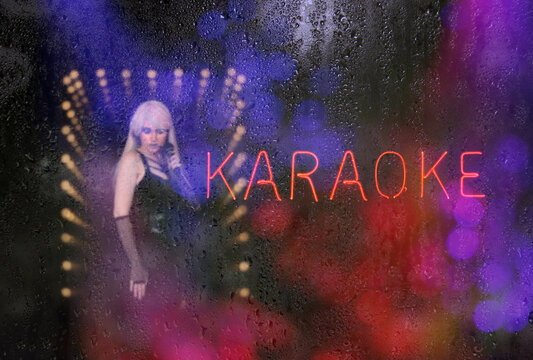 Neon Karaoke Sign with wet window, Focus on Sign