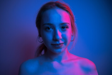 portrait of young woman in colorful light