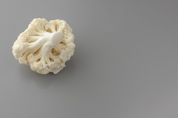 Cauliflower isolated on gray background. Copy space. Cooking recepies. White and green. Vegetarian. Organic.