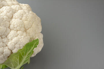 Cauliflower isolated on gray background. Copy space. Cooking recepies. Vegetarian food. Organic
