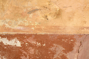 Old orange colour wall. Grunge style. Scraches close up surface. Split horizontal background.