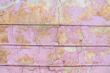 Pink cracked contrete wall. Background
