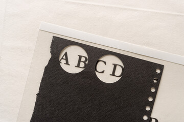 part of an alphabet set on transparency with black paper