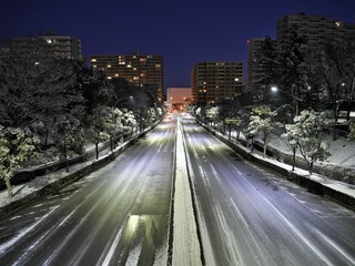 Tokyo,Japan - January 7, 2022: Traffic in the snow at dawn at Tama area in Tokyo, Japan
