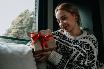 excited woman holding gift box