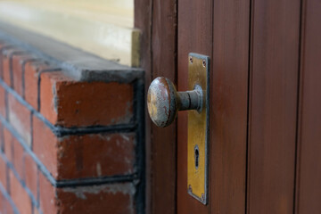brass handle of old wood door.