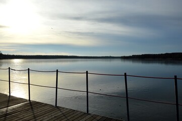 Beautiful sunset on the lake. Evening walk along the lake shore. Perfect wallpaper.