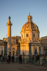 Fototapeta na wymiar Blue sky above the Church of the Most Holy Name of Mary at the Trajan Forum and Trajan column in the sunset light in Rome, Italy