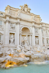 Fototapeta na wymiar The Trevi Fountain in the Trevi district in Rome, Italy, in the evening