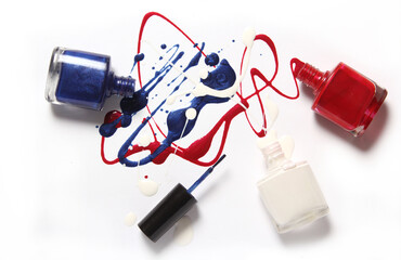 Red and Blue Spilled Nail Polish on White Background