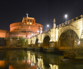 Illuminated  bridge across the Tiber river  in Rome, Ponte San Anelo and Castel San Angelo
