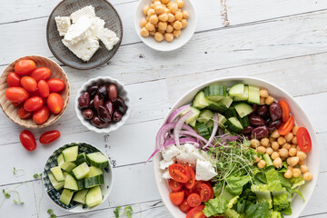 Top down view of a Greek salad bowl with copy space above.