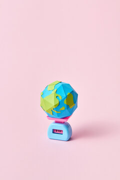 Earth globe on scales