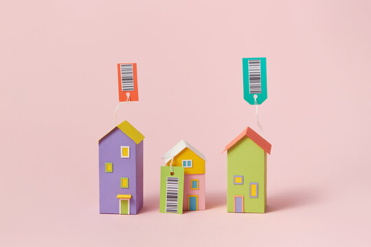 Papercraft houses with tags and barcodes
