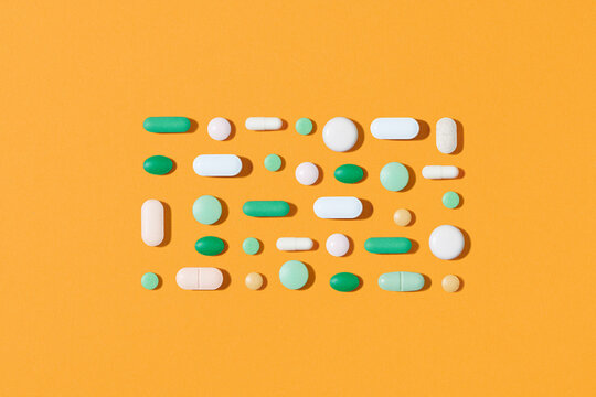 Creative layout of colorful pills and capsules