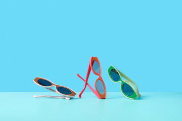 Three colorful sunglasses in studio