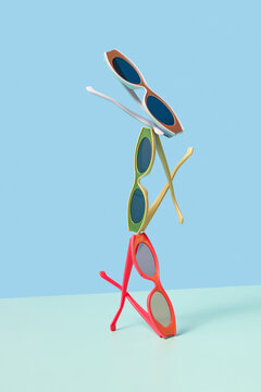 Three colorful sunglasses in studio