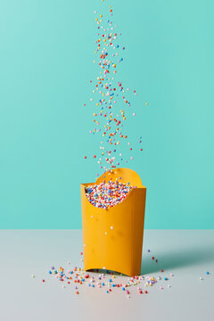 Colored spheres falling in paper bag