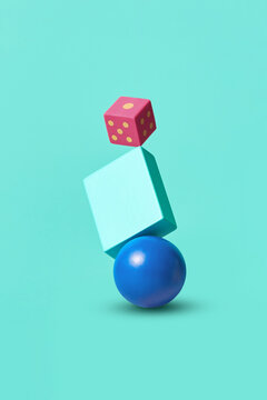 Dice balancing on rectangle and ball