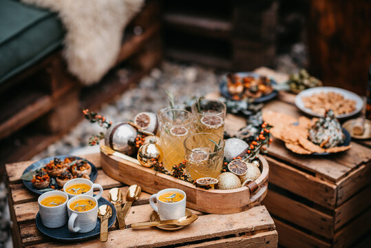 Outdoor Christmas table with food and drinks