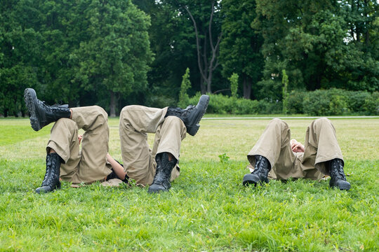 Three military men resting