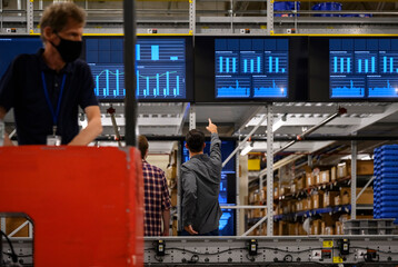 Busy Warehouse floor with forklift Driver on floor
