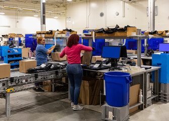 Two workers together report for work at warehouse 