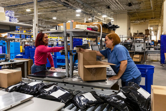 Employees sharing product at work 