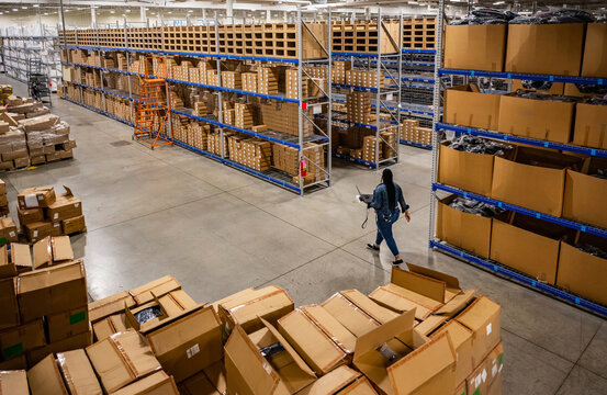 Employee walking in ecommerce warehouse