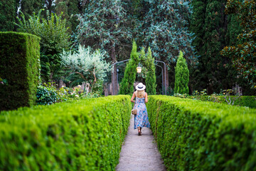 Anonymous traveler strolling in summer park