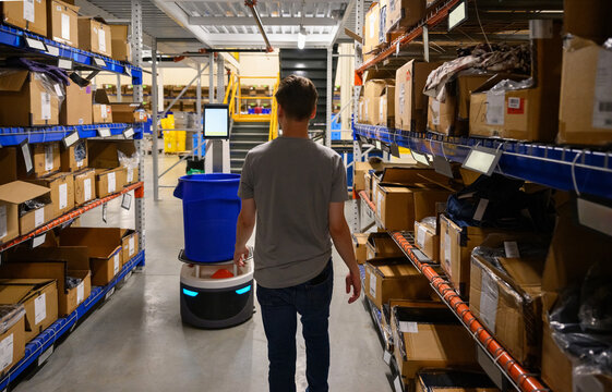 Modern and busy warehouse with robots 