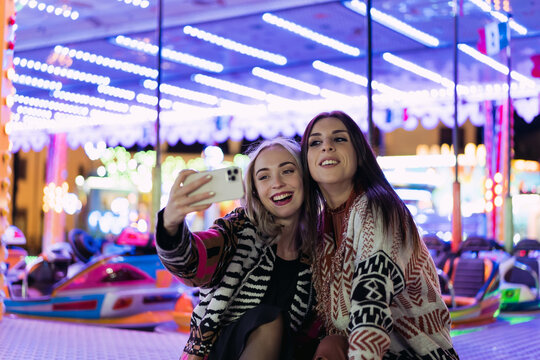 Women taking a selfie in the amusement park