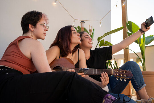 Teen friends doing selfie outdoor - Powered by Adobe