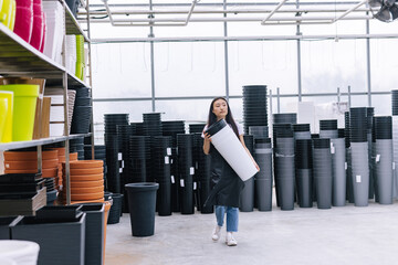 Young female staff working in shop 
