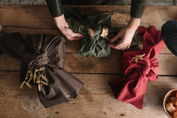Woman Decorating Furoshiki with Floral Ornament