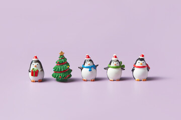 Ceramic statuettes of penguins and christmas tree