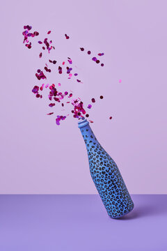 Painted champagne bottle with colorful confetti