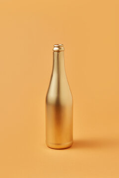 Bottle of champagne painted in golden color