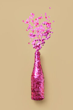 Decorated bottle of champagne with confetti splash