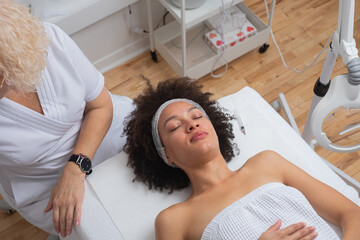 Woman Lying On The Bed At The Skin Care Therapist's