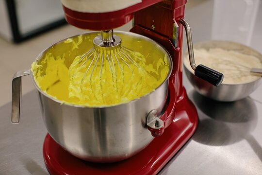 Mixer with raw dough on table
