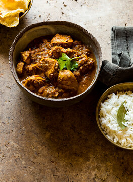 Serving of Indian Curry Food Chicken and Rice