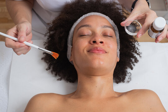 Smiling Woman Having A Facial Cosmetic Treatment