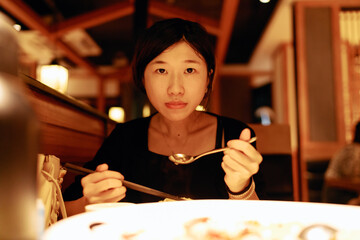 Young female having dinner