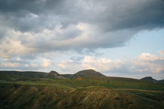 Bright van on a green meadow
